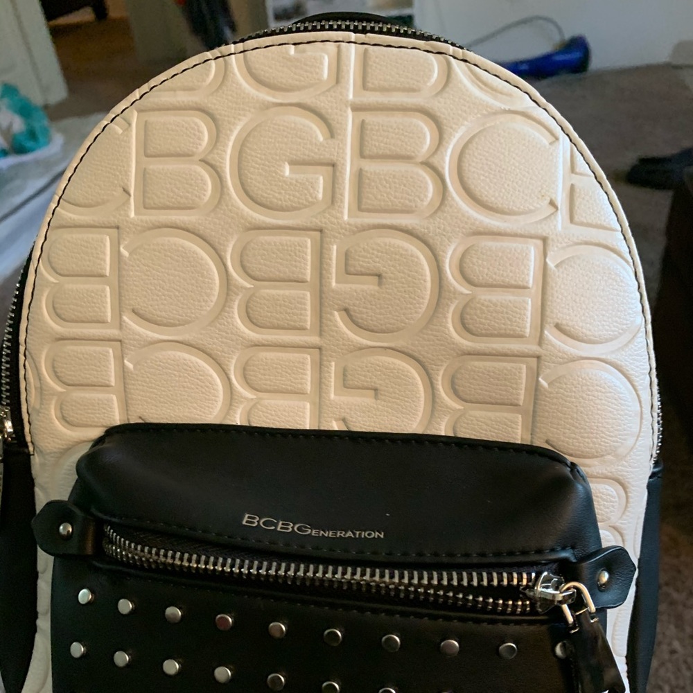 This is a black and white mini back pack